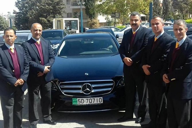 Airport pickup or drop off transfer from or to Amman city - Queen Alia arrivals, the name sign, and the first-contact moment
