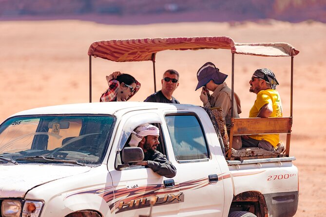 Jeep Tours in Wadi Rum with Bedouin Guide 2,3,4,5 hours | Magic Bedouin Star - Khazali Canyon and the Red Sand Dune: small climbs, big payoff