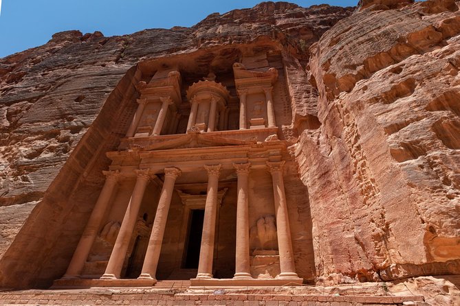 Petra 1 Day Tour from Aqaba - Entering Petra: al Siq and the Treasury, with a guide doing the explaining