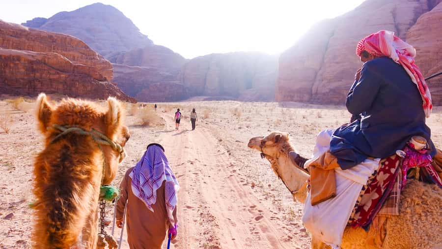 Wadi Rum: 10 Hour Jeep Tour Pass, Camel, Sandbording & Lunch - Camel Ride and Sandboarding, With Safety Built In